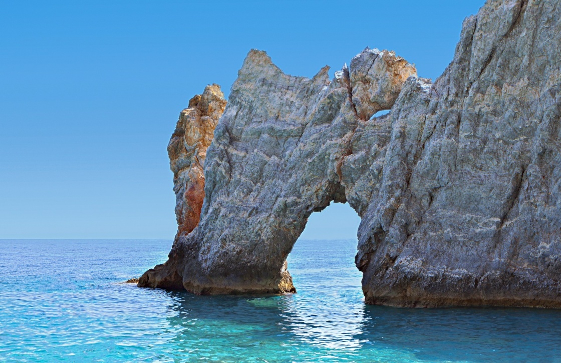 Lalaria beach and the famous holey rock at Skiathos island in Greece